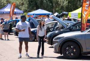 People enjoying a Drive Electric Earth Month Event